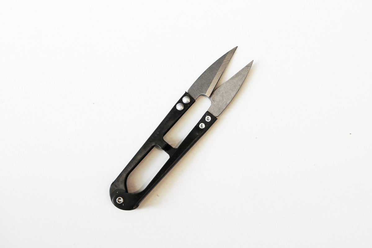 Precision Herb Snips with sharp silver metal blades and a compact black handle featuring oval cutouts.