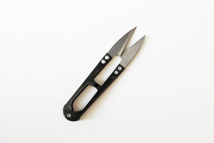 Precision Herb Snips with sharp silver metal blades and a compact black handle featuring oval cutouts.