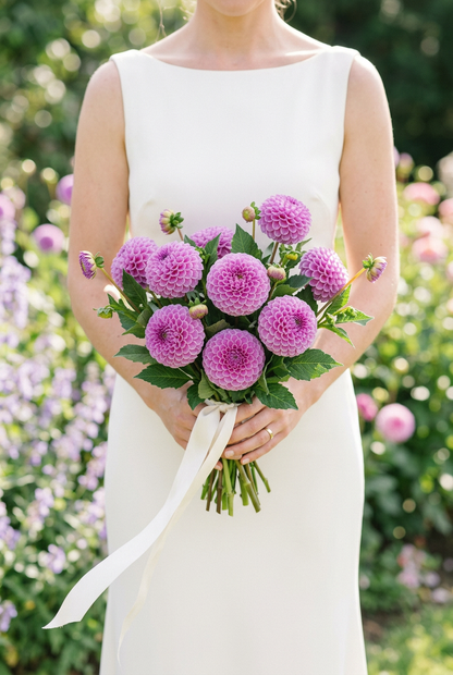AI-generated bridal styling inspiration: bride holding lavender-pink Franz Kafka dahlias